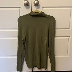 Green turtleneck sweater